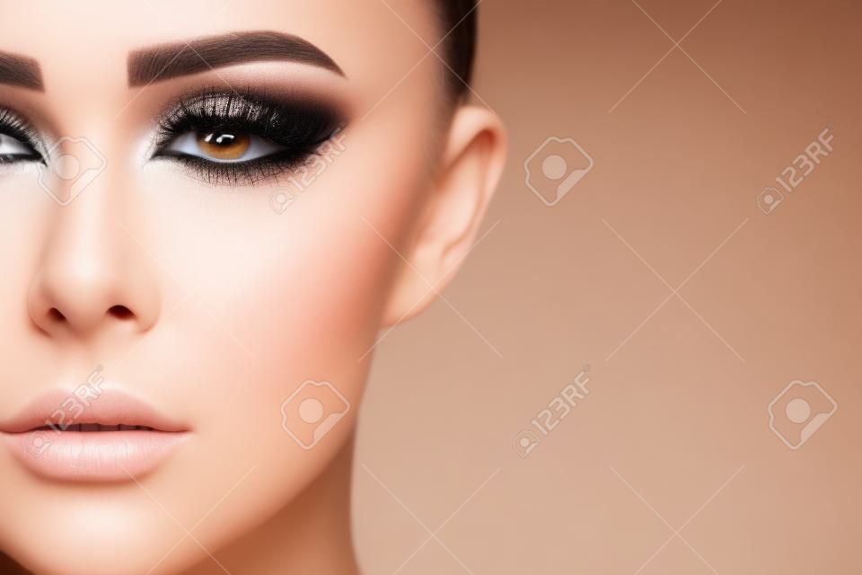 Plastic Surgery Operation. Closeup Beautiful Young Woman Face With Fresh Skin And Perfect Makeup On White Background. Female Face With Black Surgical Lines On Eyelids. High Resolution