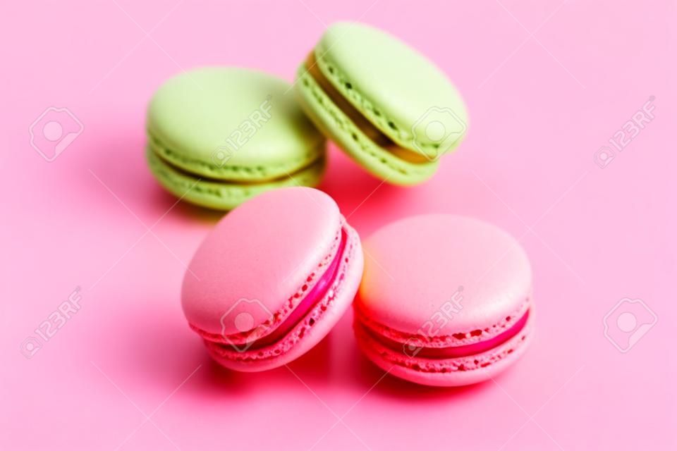 Macarons. Colorful Dessert On Pink Yellow Background. High Resolution