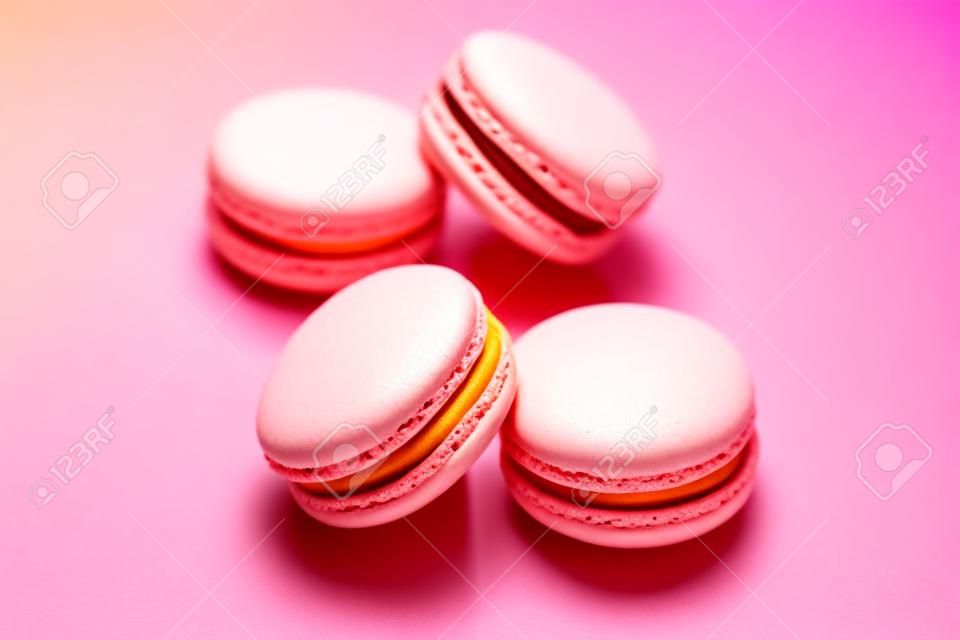 Macarons. Colorful Dessert On Pink Yellow Background. High Resolution