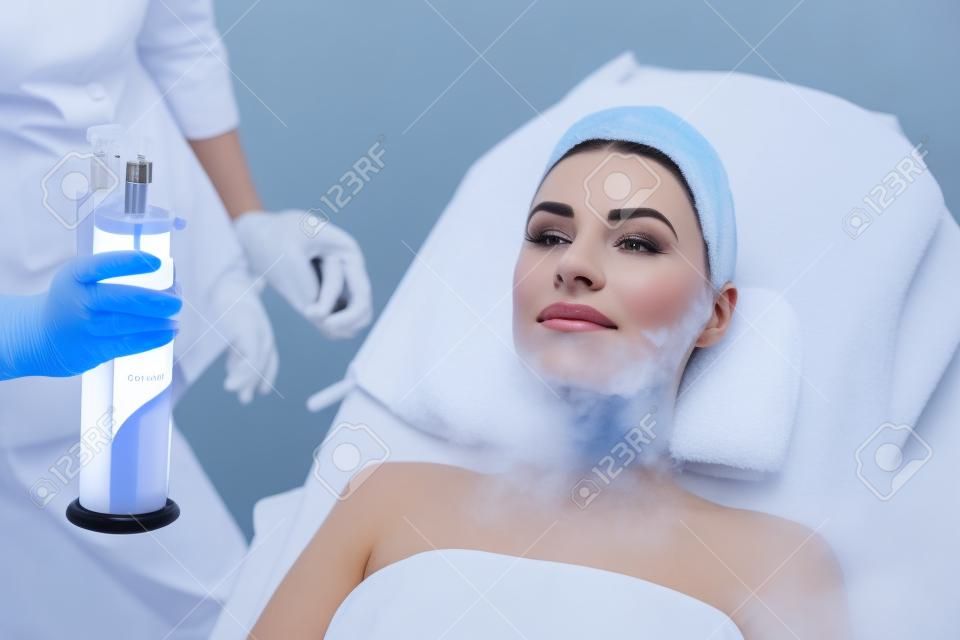 Cosmetology. Woman At Facial Oxygen Cryotherapy At Beauty Centre. Cryo Treatment On Face. High Resolution
