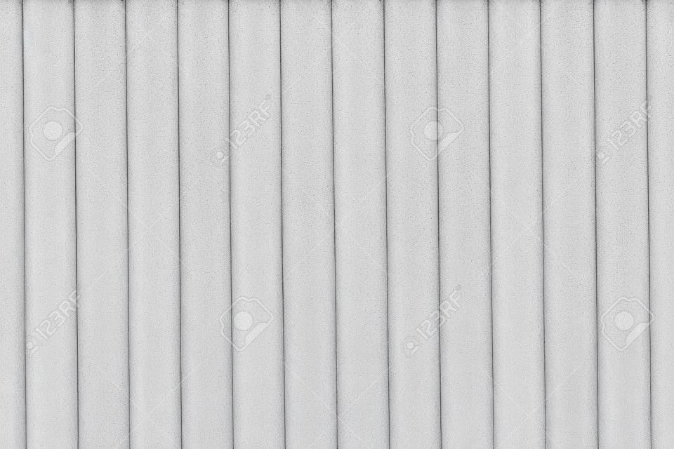 Old white ribbed concrete wall texture background.