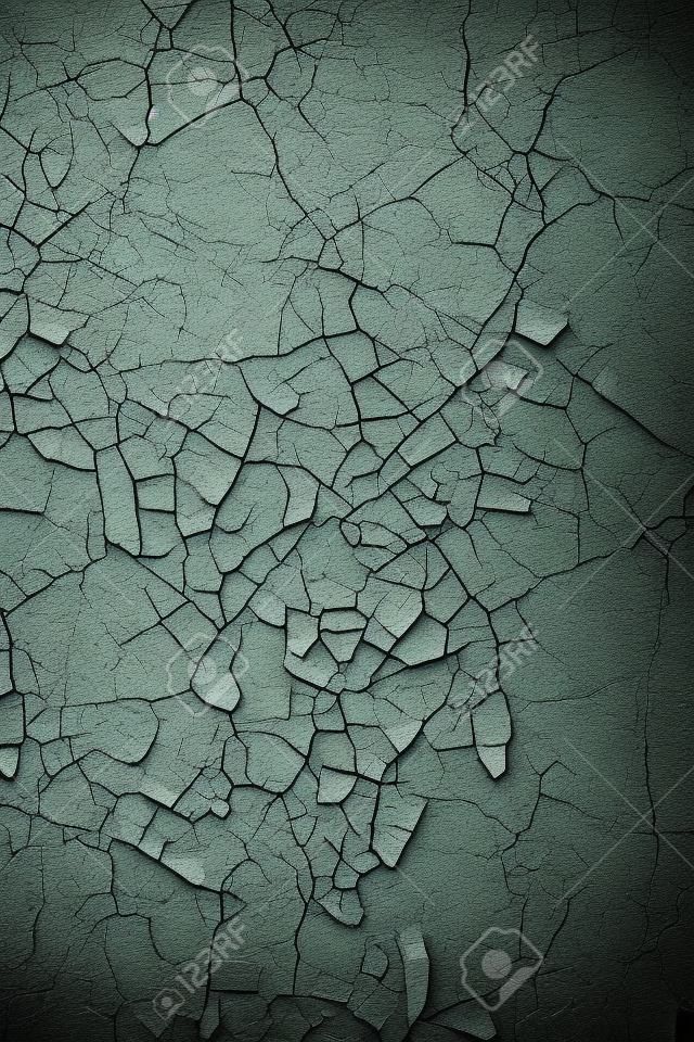Vertical grunge background - wall covered with cracked paint