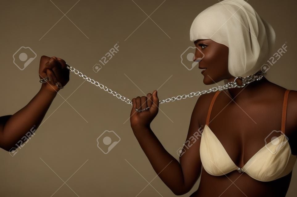 beautiful woman in the role of a slave on a leash