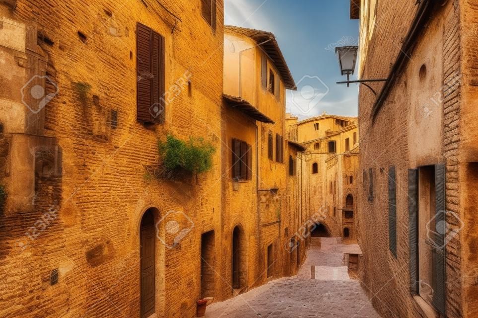 Street view with old buildings in Siena, Italy.