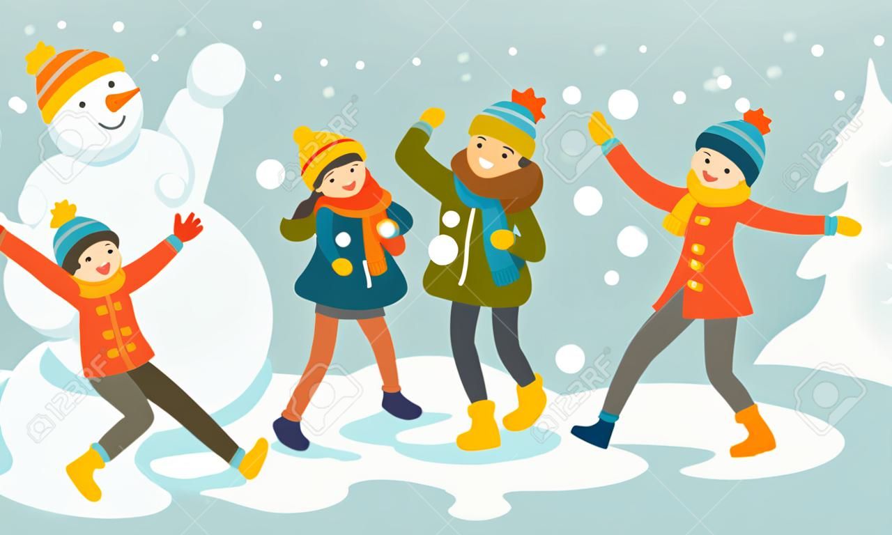 Молодая счастливая семья играет в снежки и веселится в снегу зимой.