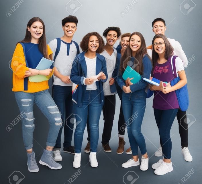 Group of students smiling and standing together