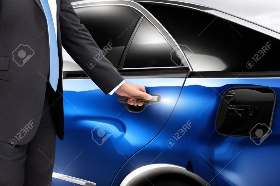 Businessman opening limo car door