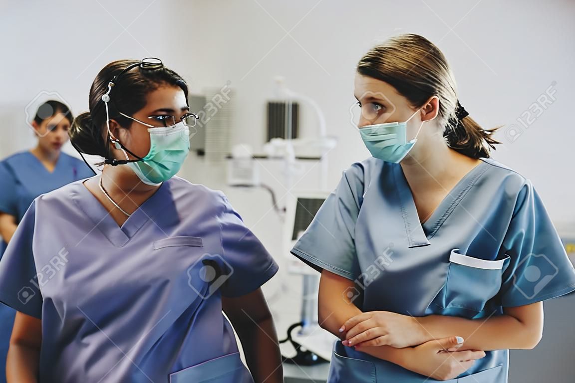 Nurses having a conversation in the ICU