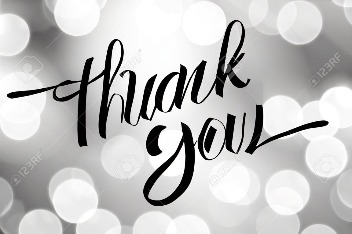 thank you, vector lettering on blurred lights background