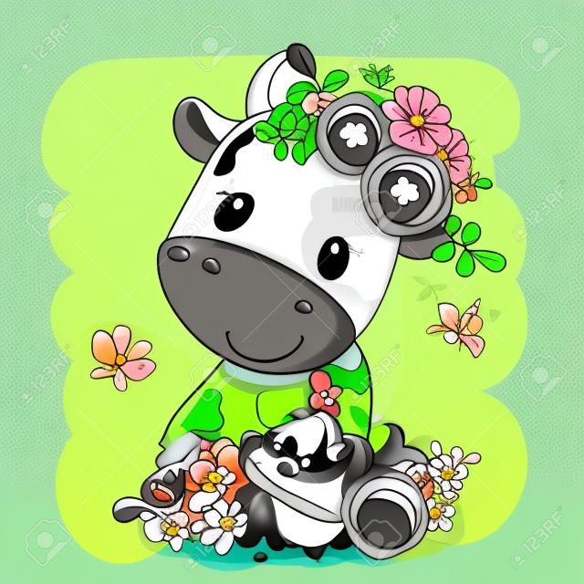 Vaca de dibujos animados lindo con flores sobre un fondo verde