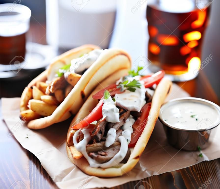 greek gyros with tzatziki sauce and fries