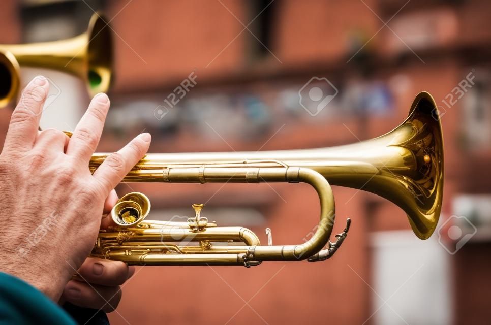 Closeup of the fingers of a male trumpet player in a Mexican city