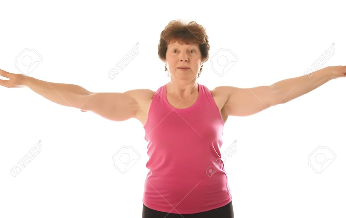 middle age senior woman fitness exercising shoulder raise strength training with dumbbell weights