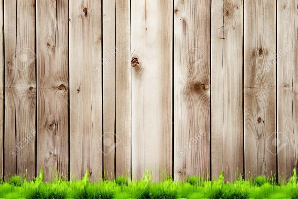 Lente groen gras over houten hek achtergrond