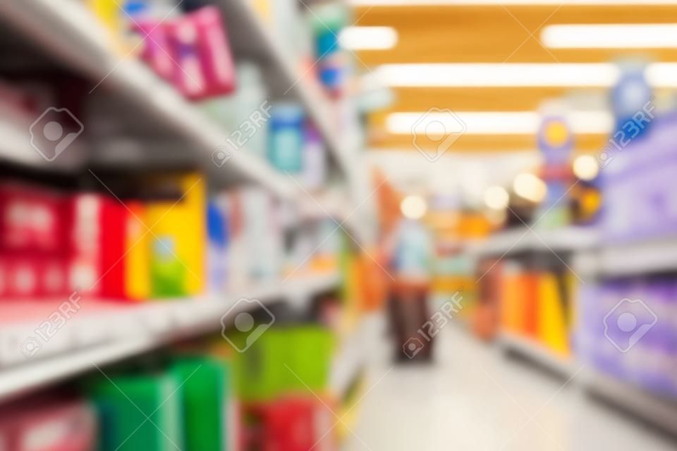 Blurred section at retail store in Europe. Aisle in local supermarket, defocused background