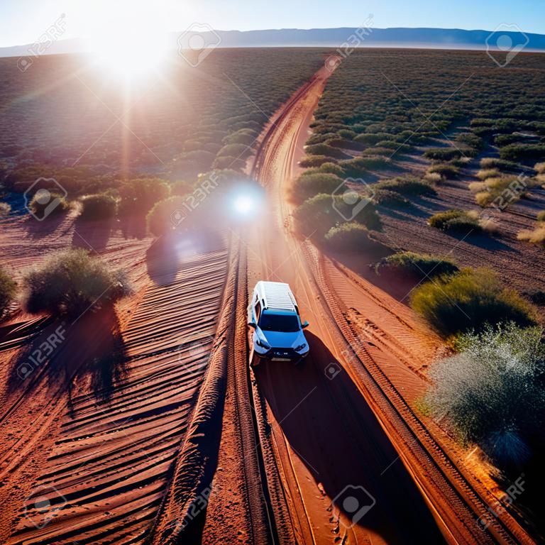 Off road desert adventure, car and tracks on sand in the Australian Outback. Western Australia