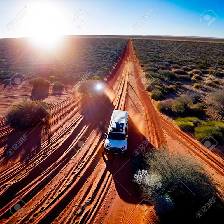 Off road desert adventure, car and tracks on sand in the Australian Outback. Western Australia