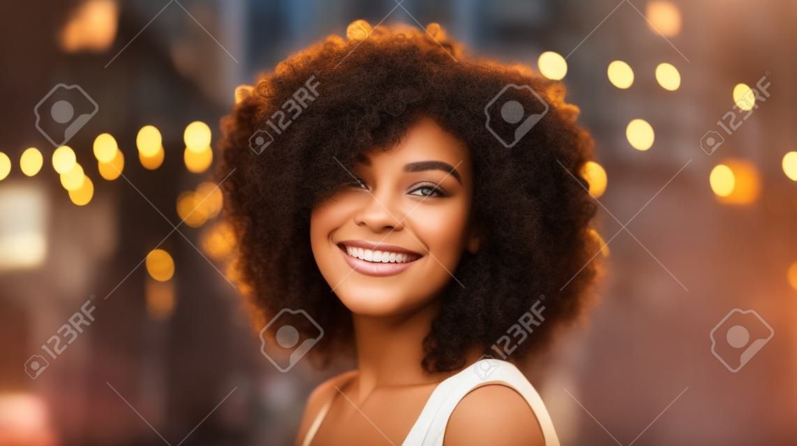 Beautiful african american woman with curly hair in the city