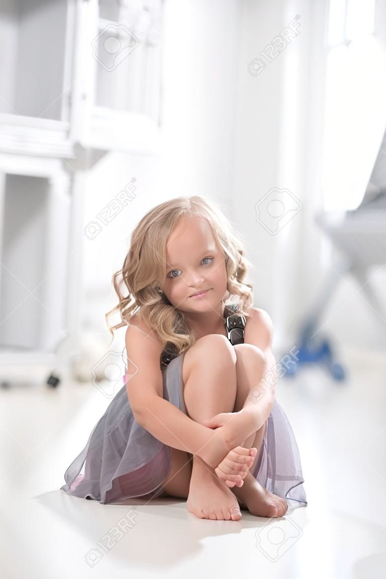 Female child sitting on the floor