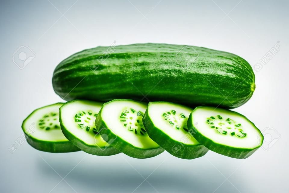 Fresh cucumber with slices isolated on the white 