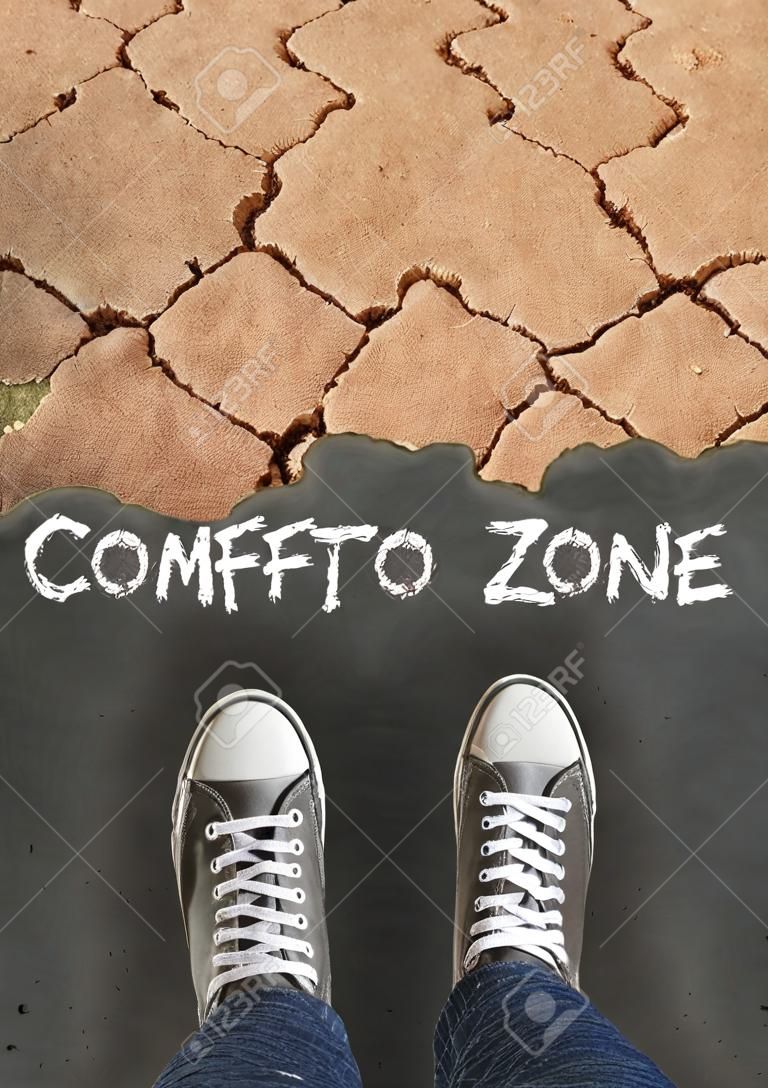 Feet standing on asphalt road to dry land. Dare to take chance, difficult journey, move from comfort zone concept