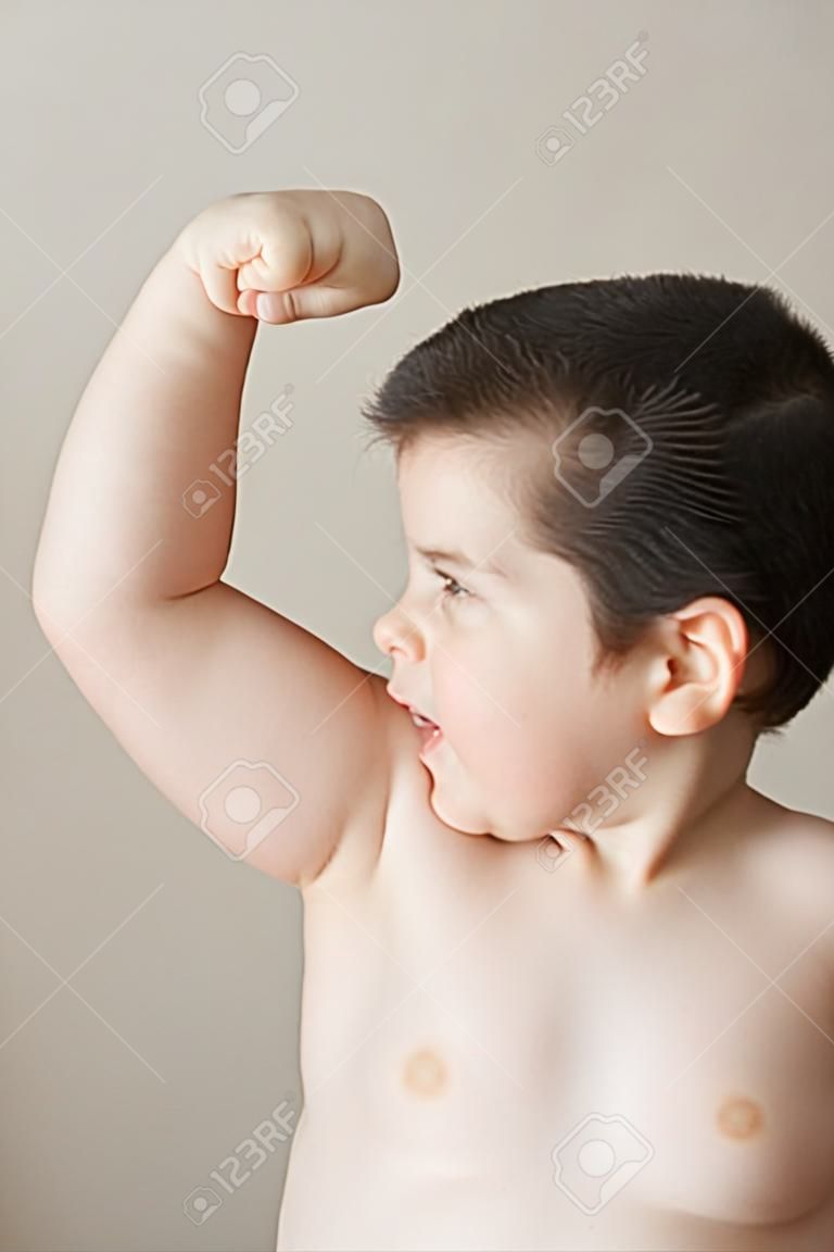 bad fat boy  shows his biceps  muscles