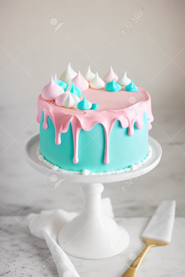 Birthday cake decorated with meringue kisses