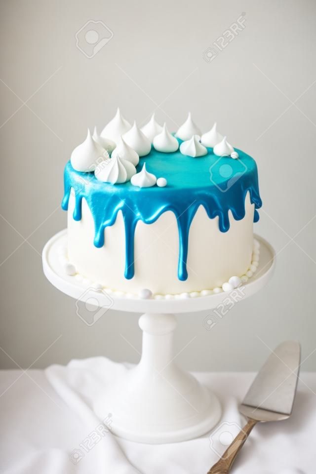 Birthday cake decorated with meringue kisses