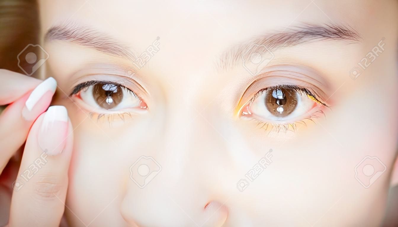 close up of beauty woman pointing her eye