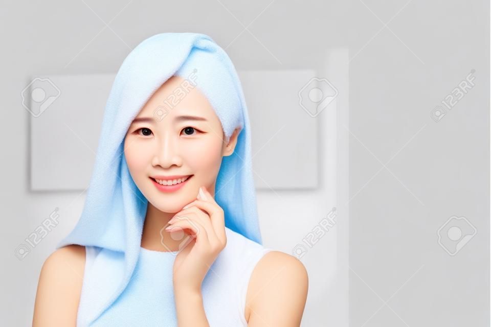 Beauty skin care woman touch her chin and smile to you at home