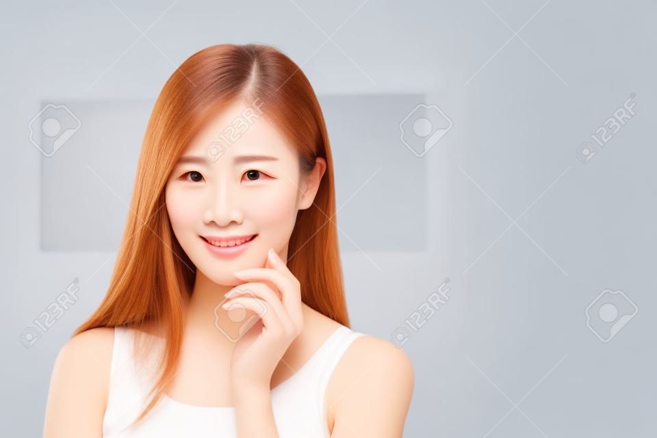 Beauty skin care woman touch her chin and smile to you at home