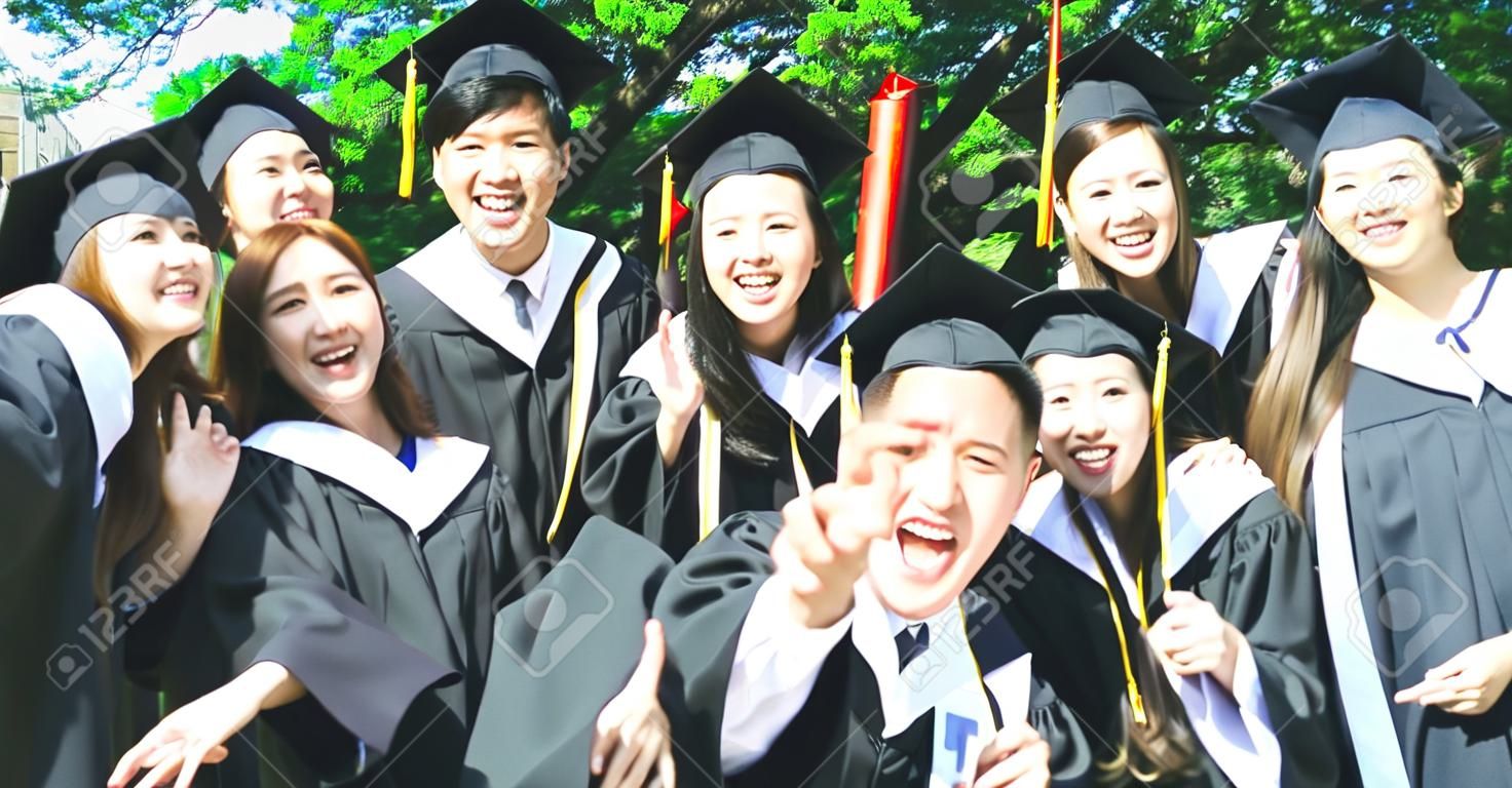 group happy graduate students use mobile phone to take picture together