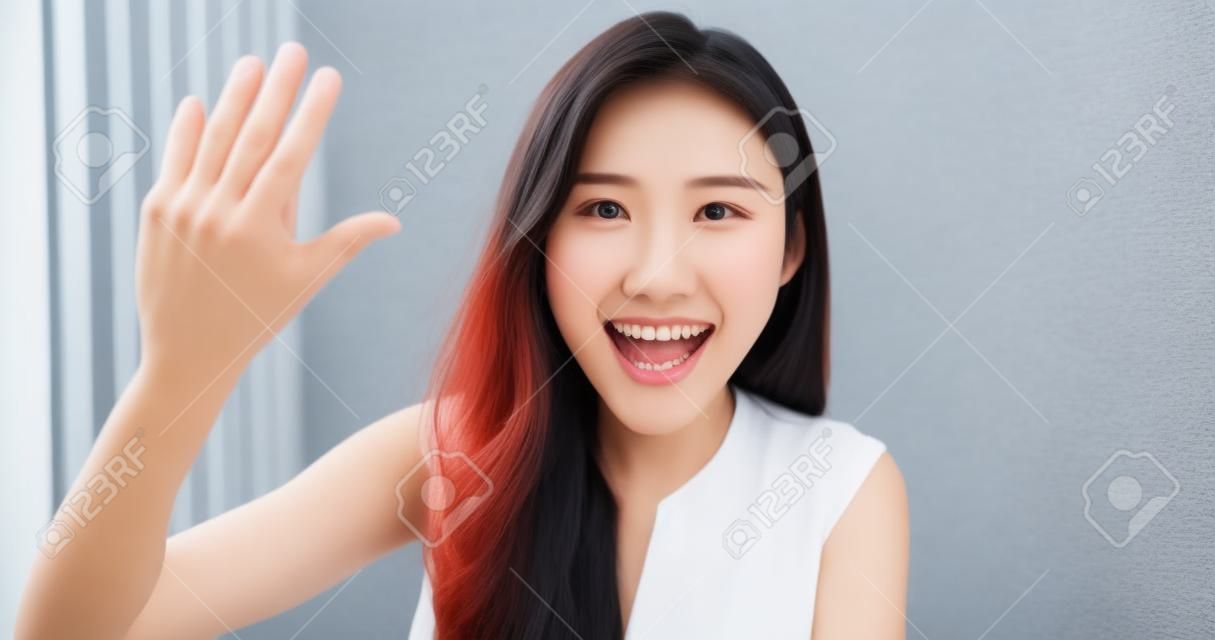 asian young woman has chat with friends with smart phone