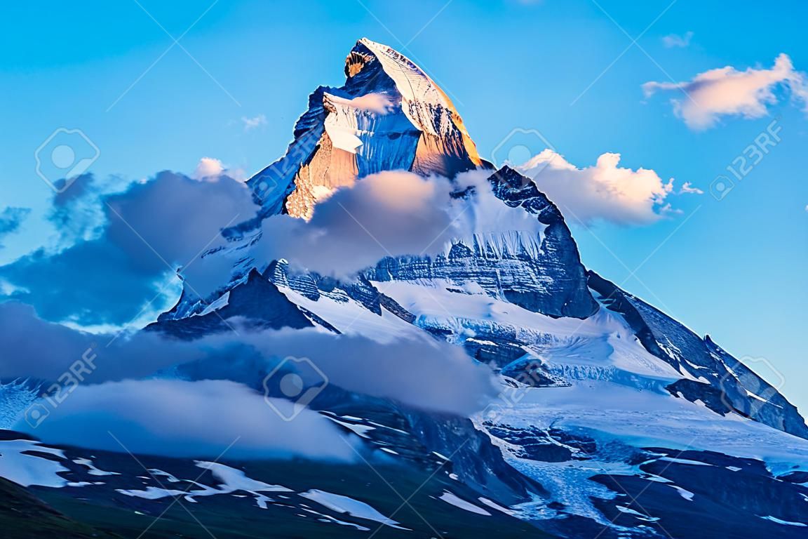 Matterhorn mountain range of the Alps, located between Switzerland and Italy at sunset