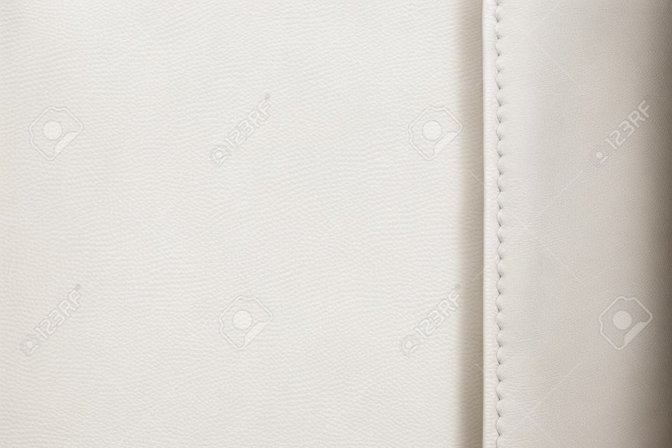 Texture of white leather, seam, close-up