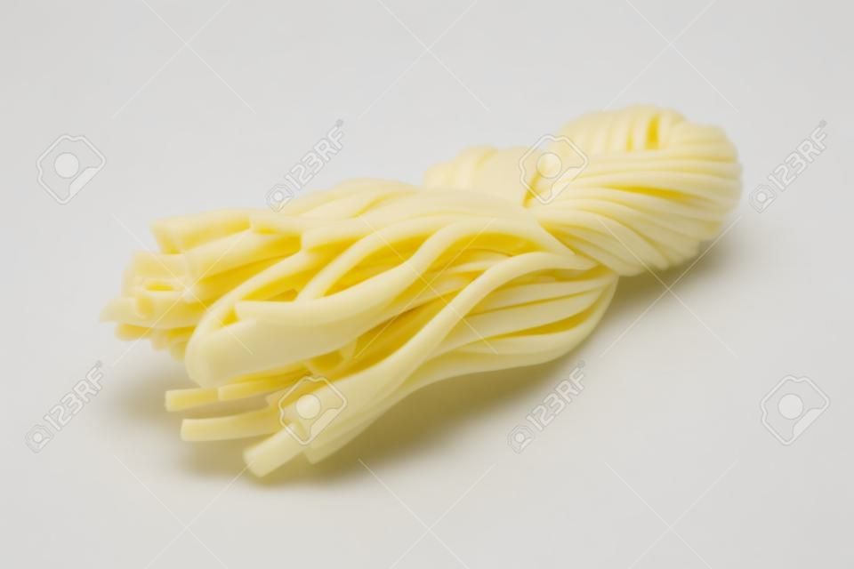 Cheese pigtail close up isolated on white