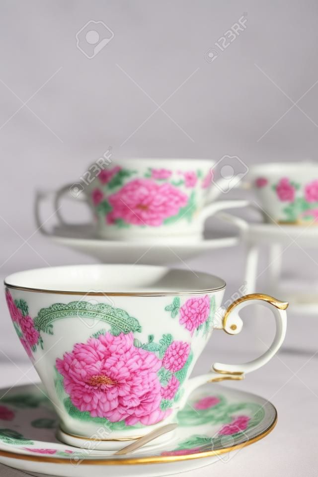 Antique porcelain mug, decorated with pink bouquet 