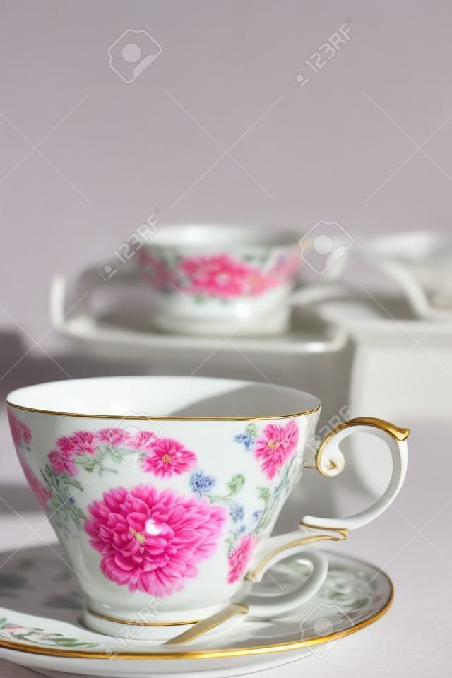 Antique porcelain mug, decorated with pink bouquet 