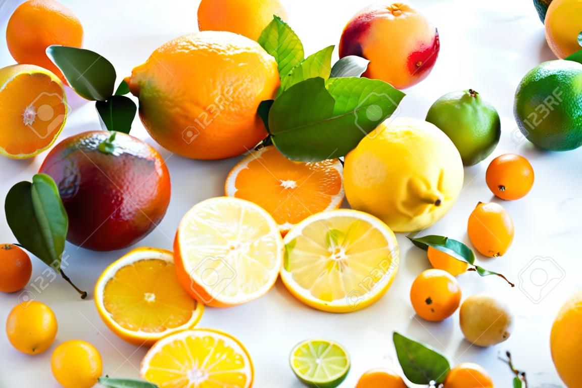 Assorted fresh citrus fruits with leaves
