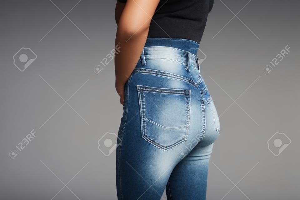 young woman posing in jeans