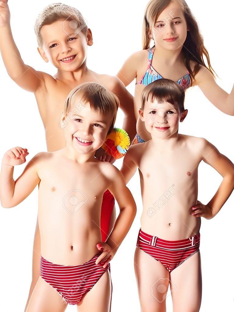 Three happy kids in swimsuit standing together, isolated on white