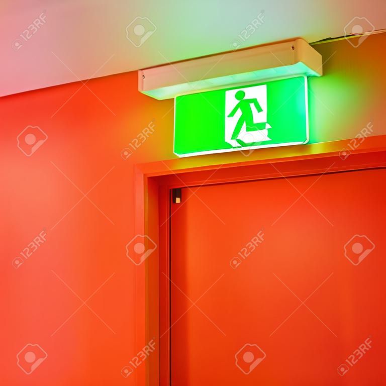 Bright green safety exit signal. Help to escape in an emergency.