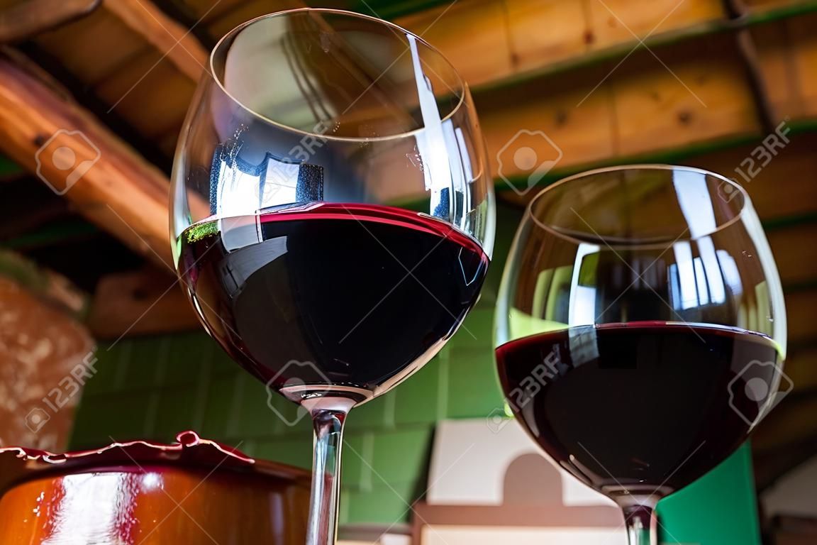 Glass of red wine on a table in rustic restaurant