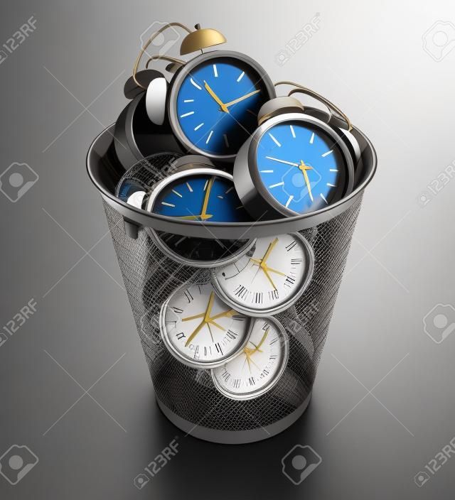Wasting time concept: alarm clocks in the trash bin