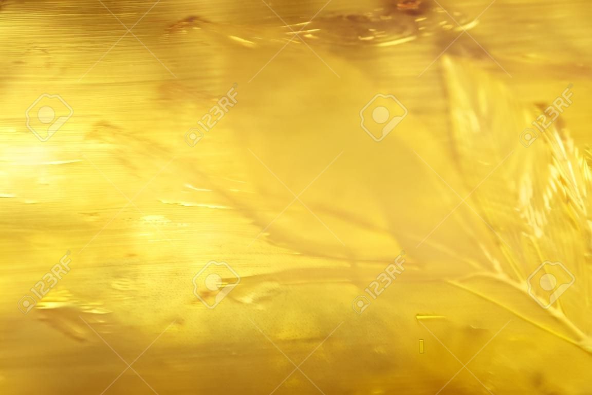 Fundo brilhante da textura da folha de ouro da folha amarela