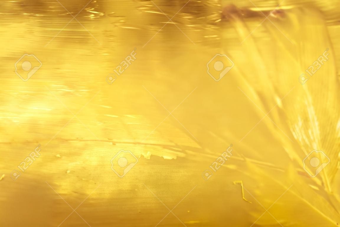 Fundo brilhante da textura da folha de ouro da folha amarela