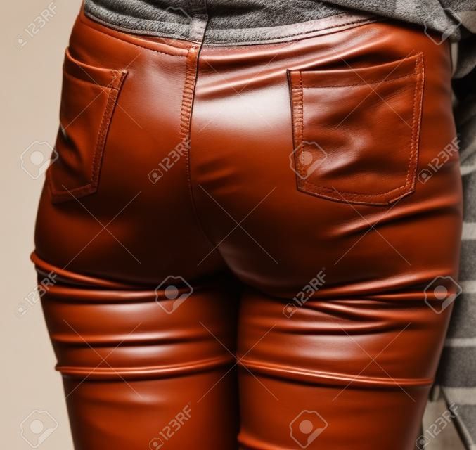 Leather Pants On The Legs Of The Girl . Stock Photo, Picture and Royalty  Free Image. Image 124634559.