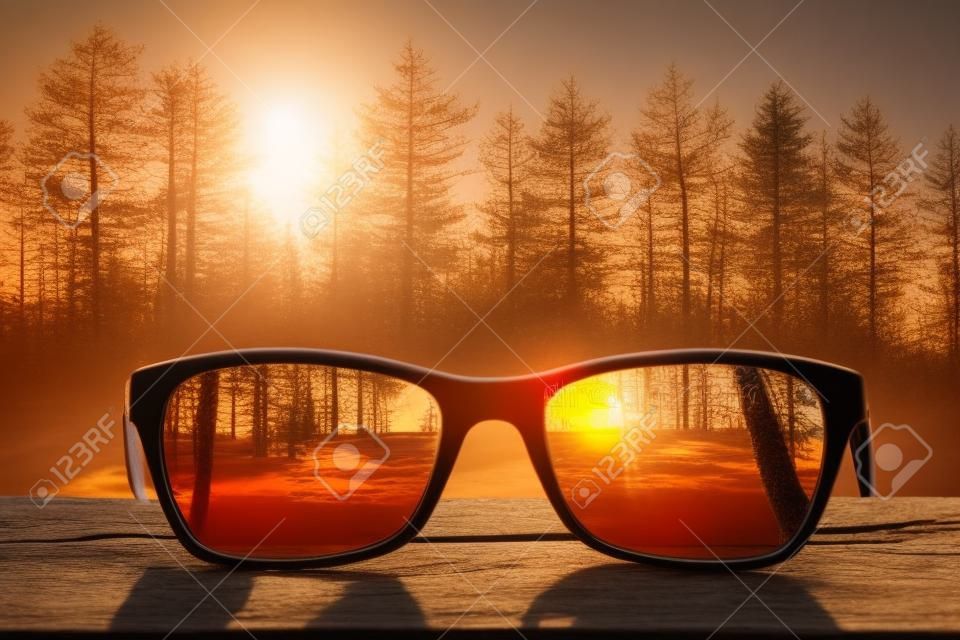 glasses focus background wooden eye vision lens eyeglasses nature reflection look looking through see clear sight concept transparent sunrise prescription sunset vintage sunny sun retro - stock image