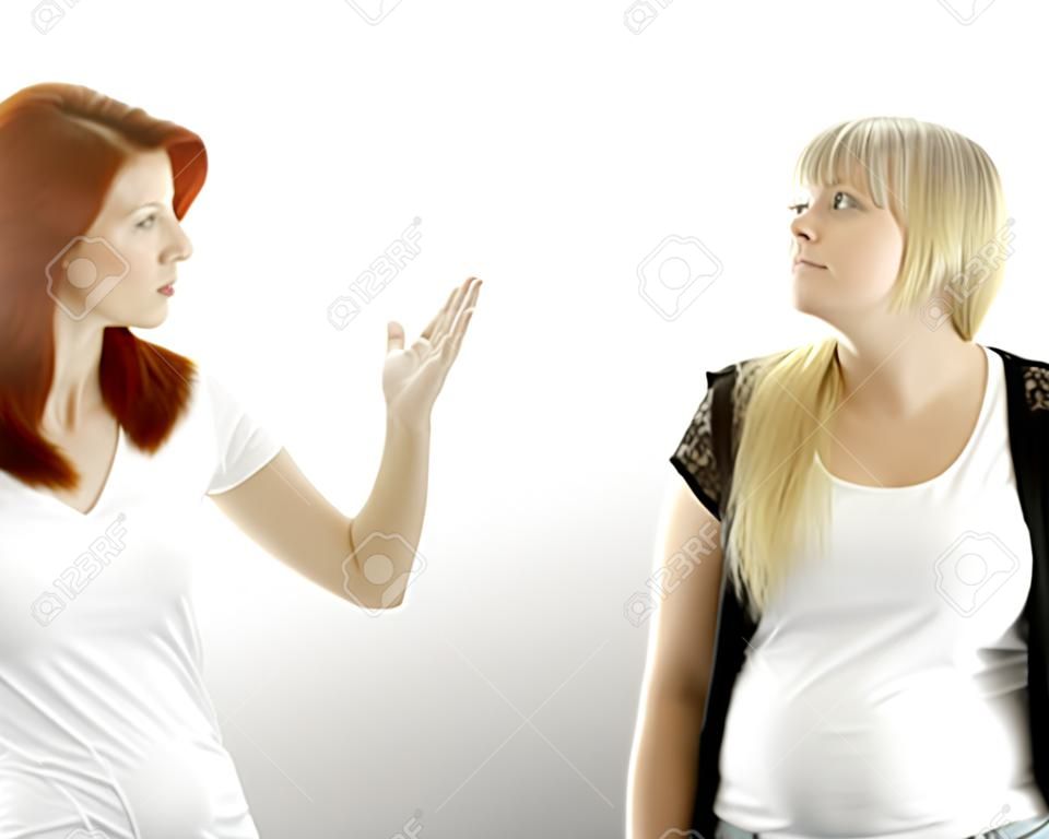 young beautiful red and blond haired girls stop it in front of white background