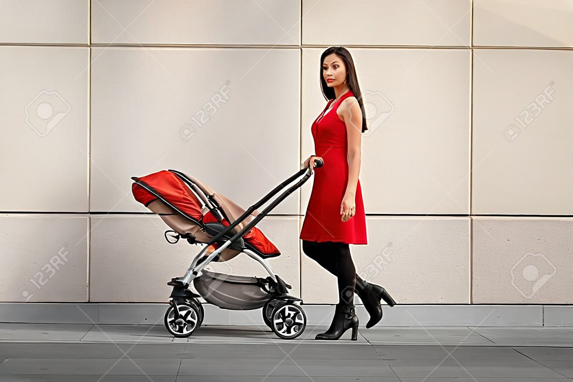 Woman walking with carriage